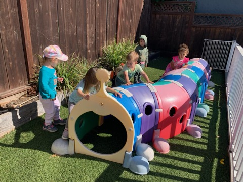 Toddlers building and playing with friends